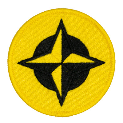 Innova Proto Star Patch. Shows a round patch with black and yellow four point star with a black and a yellow circle behind it.